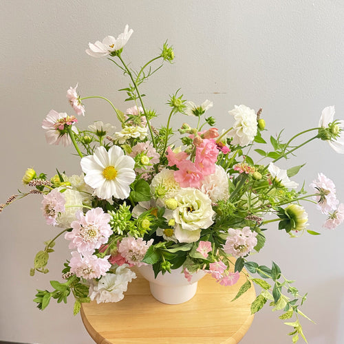 subtle blush and white sweet floral arrangement baby girl